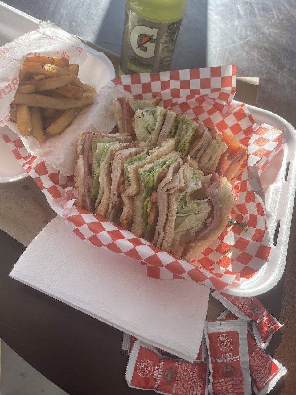 Printed menu with burgers and sandwiches.